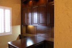 Custom home office cabinets with dentil molding.